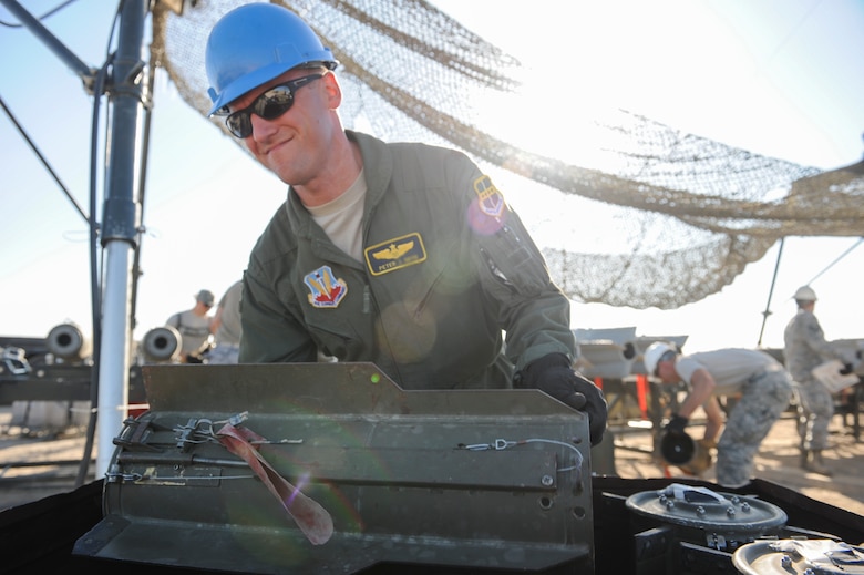 Maj. Peter, a participant in the Senior Officer Orientation course, lifts a tail fin out of a storage container which will be attached to the main body of an MK-82 at Beale Air Force Base, California, Aug. 30, 2017. Guided bomb units can used in conjunction with multiple delivery systems to include infrared, laser, and satellite guided systems. (U.S. Air Force photo/Senior Airman Justin Parsons)