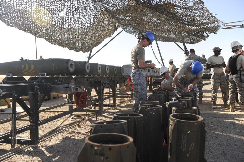 Senior officers and munitions Airmen prepare bomb fins and other resources for assembly during an Senior Officers Orientation course at Beale Air Force Base, California, Aug. 30, 2017. The training environment for the SOO course mimics a forward deployed location and the minimal resources needed for the assembly of munitions. (U.S. Air Force photo/Senior Airman Justin Parsons)