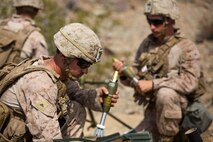 Marines from 1st Battalion, 1st Marine Regiment, prepare for a rapid fire on the enemy target during an individual training exercise at Range 410A aboard the Marine Corps Air Ground Combat Center, Twentynine Palms, Calif., July 25, 2017. 1/1 is based out of Marine Corps Base Camp Pendleton, Calif., and is serving as part of the GCE during ITX 5-17. (U.S. Marine Corps photo by Pfc. Margaret Gale)
