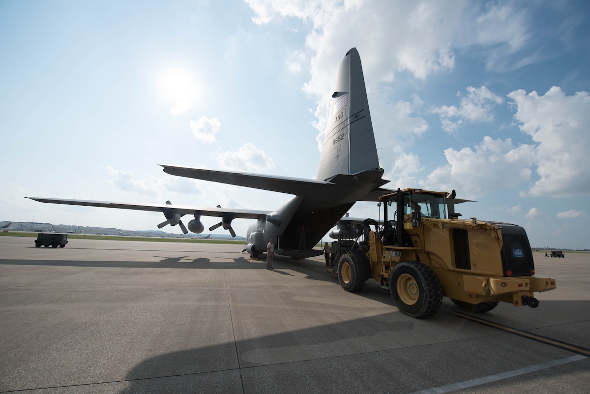 Airmen from the 123rd Airlift Wing load equipment and vehicles onto a C-130 Hercules aircraft at the Kentucky Air National Guard Base in Louisville, Ky., Sept. 20, 2017. The cargo will be used by members of the 123rd Special Tactics Squadron, who deployed to the Caribbean on Sept. 20 to conduct relief operations in the wake of Hurricane Maria.