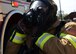 Airman Marcus Gray, 51st Civil Engineer Squadron firefighter, dons his gas mask before responding to a simulated building fire during exercise Beverly Herd 17-3 at Osan Air Base, Republic of Korea September 20, 2017. The exercise was held to evaluate how well base units provided emergency support while defending assets and personnel in a hostile chemical, biological, radiological and nuclear environment. (U.S. Air Force photo by Tech Sgt. Ashley Tyler)