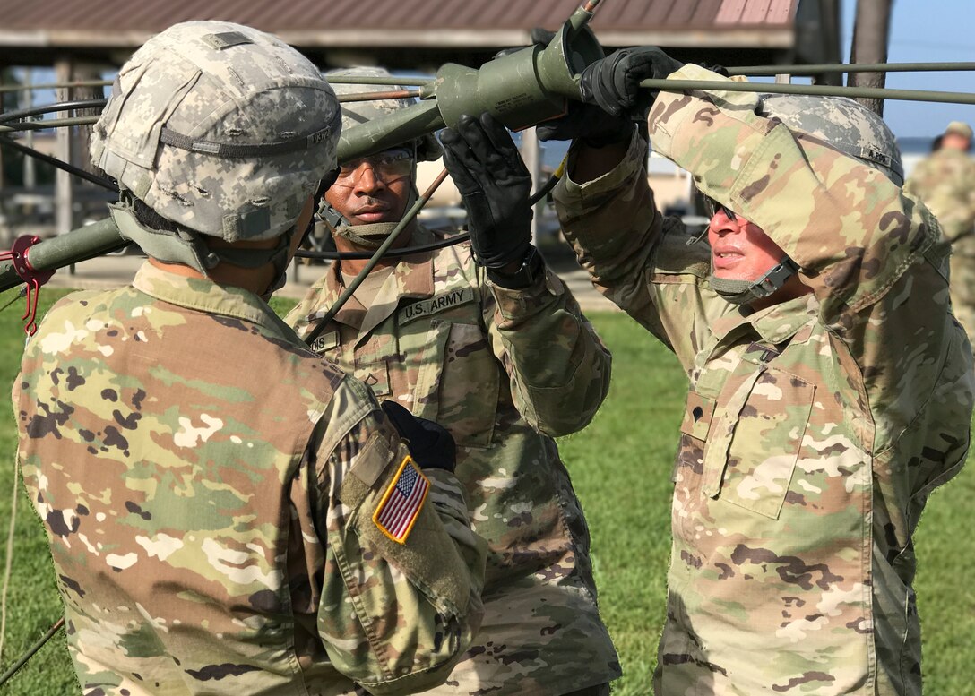 U.S. Army Soldiers assigned to the 558th Transportation Company, 10th Transportation Battalion, 7th Transportation Brigade (Expeditionary) assemble an OE-254 radio antenna during the company’s first “Maintenance Rodeo” competition at Third Port, Joint Base Langley-Eustis, Va., Sept. 20, 2017.