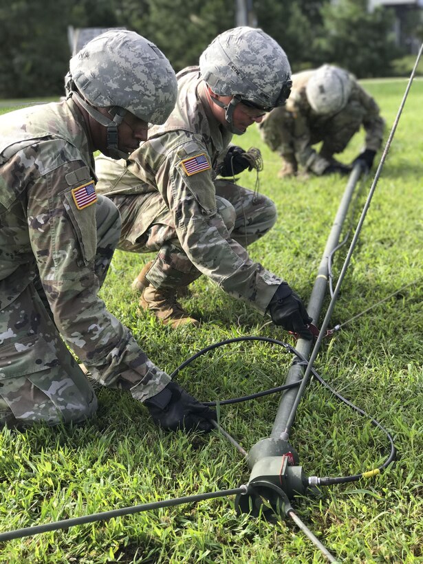 U.S. Army Soldiers assigned to the 558th Transportation Company, 10th Transportation Battalion, 7th Transportation Brigade (Expeditionary) assemble an OE-254 radio antenna during the company’s first “Maintenance Rodeo” competition at Third Port, Joint Base Langley-Eustis, Va., Sept. 20, 2017