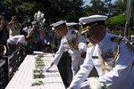 Capt. Hank Kim, chief of staff of Commander, U.S. Naval Forces Korea, and Capt. Kwang Lee, U.S. Navy Attache', lay flowers at the Gen. Douglas MacArthur statue during the 67th Incheon Landing Operations Commemoration Ceremony. Incheon landing was a combined U.S. and ROK military assault during the Korean War is considered one of the most significant and successful operations in the history of amphibious warfare.