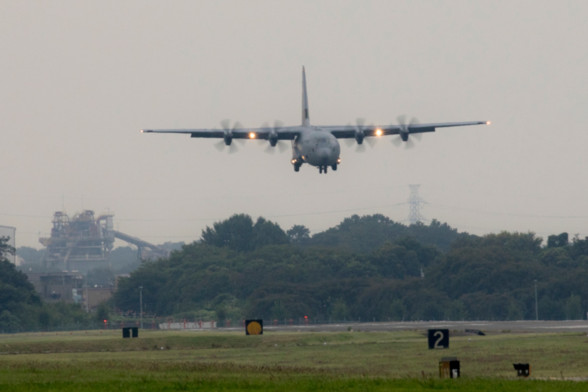 A C-130J Super Hercules approaches the runway at Yokota