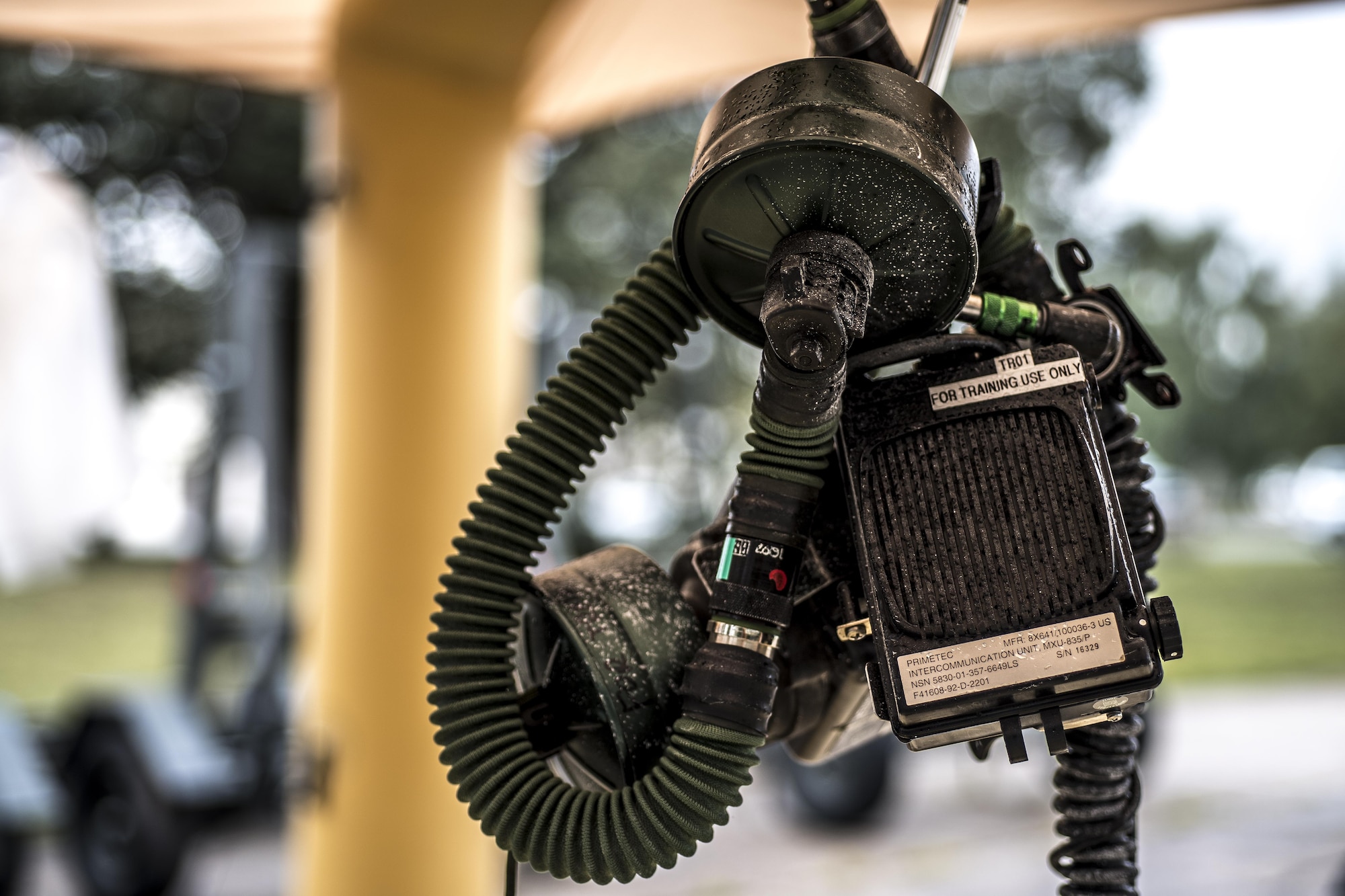 An aircrew eye and respiratory protective system hangs from a carabiner clip at a decontamination station during the Aircrew Contamination Mitigation course on Ramstein Air Base, Germany, Sept. 19, 2017.