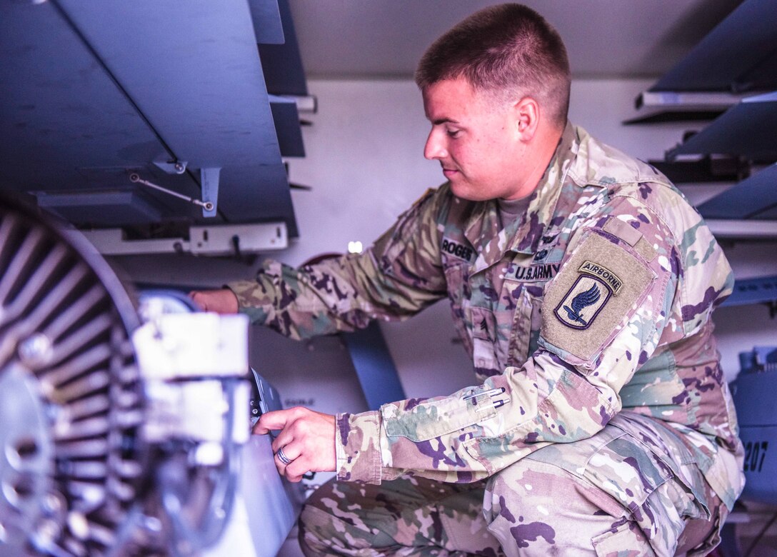 Army Sgt. Kyle Martin Rogers, an unmanned aircraft systems repairer from Delta Company, 54th Brigade Engineering Battalion, 173rd Airborne Brigade, Vicenza, Italy, inspects his unit's equipment, Sept. 8 2017. Army photo by Sgt. David Vermilyea