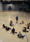 Shane Spice, Men’s and Women’s Volleyball Teams coach, speaks to players trying out for the women’s team at the Southside Fitness Center on Ramstein Air Base, Germany, Sept. 12, 2017.