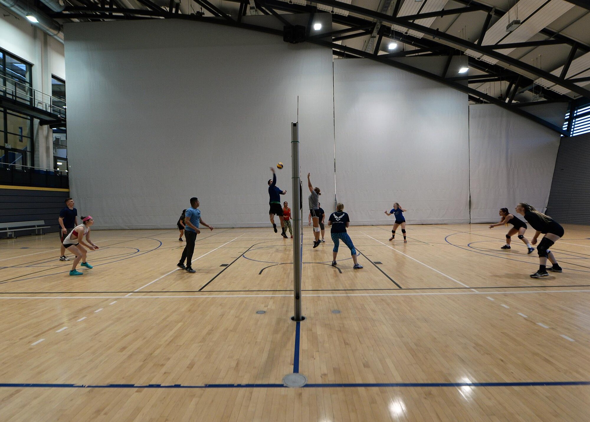 Members of the Kaiserslautern Military Community play volleyball during tryouts at the Southside Fitness Center on Ramstein Air Base, Germany, Sept. 14, 2017.