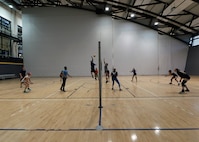 Members of the Kaiserslautern Military Community play volleyball during tryouts at the Southside Fitness Center on Ramstein Air Base, Germany, Sept. 14, 2017.