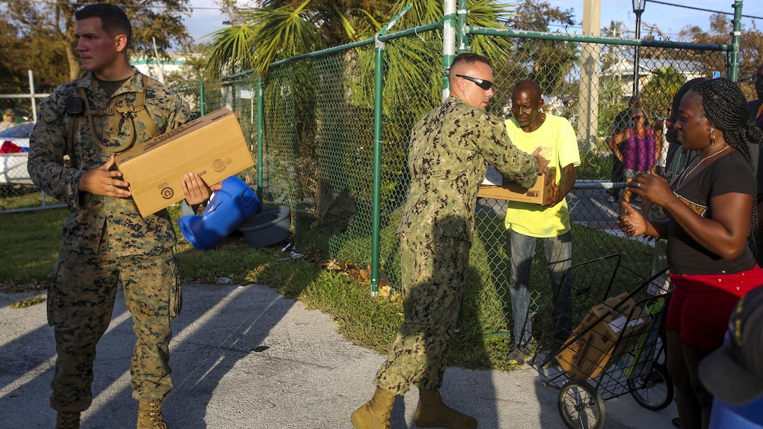 Marines and Sailors hand out food and water to the public in Key West Fl., Sept. 12, 2017. Marines and Sailors with the 26th Marine Expeditionary Unit (MEU) and Marine Heavy Helicopter Squadron (HMH) 461 helped distribute food, water, and supplies in support of the Federal Emergency Management Agency in the aftermath of Hurricane Irma.