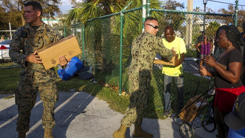 Marines and Sailors hand out food and water to the public in Key West Fl., Sept. 12, 2017. Marines and Sailors with the 26th Marine Expeditionary Unit (MEU) and Marine Heavy Helicopter Squadron (HMH) 461 helped distribute food, water, and supplies in support of the Federal Emergency Management Agency in the aftermath of Hurricane Irma.