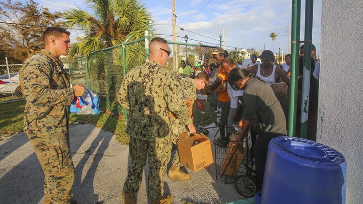 Marines and Sailors hand out water to the public in Key West Fl., Sept. 12, 2017. Marines and Sailors with the 26th Marine Expeditionary Unit (MEU) and Marine Heavy Helicopter Squadron (HMH) 461 helped distribute water and supplies in support of the Federal Emergency Management Agency in the aftermath of Hurricane Irma.