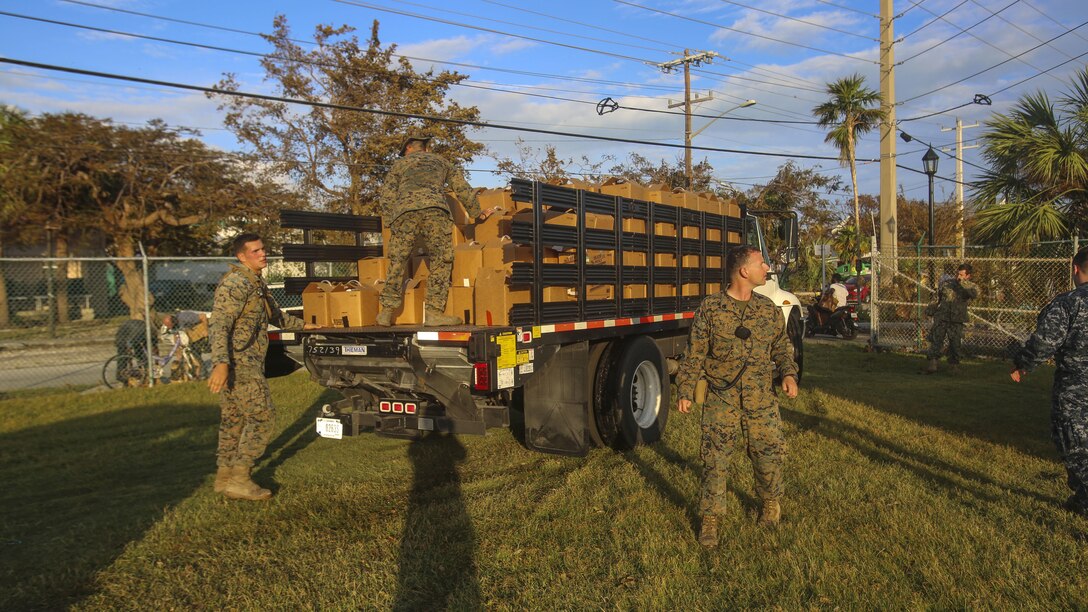 Marines and Sailors hand out water to the public in Key West Fl., Sept. 12, 2017. Marines and Sailors with the 26th Marine Expeditionary Unit (MEU) distributed water in support of the Federal Emergency Management Agency in the aftermath of Hurricane Irma.