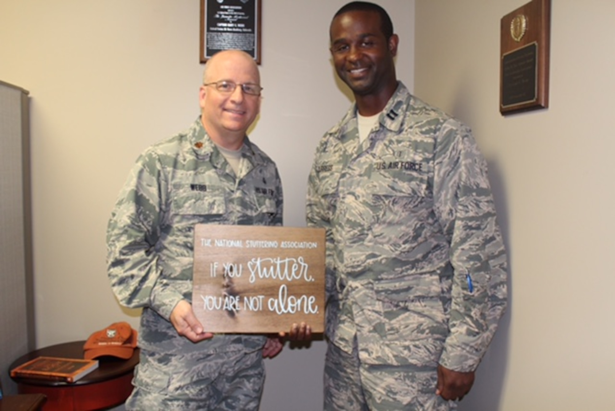 Maj. Gary Webb, 88th MDG Inpatient Squadron’s Critical Care Flight commander, and Capt. Landrus Burress, USAFSAM Chief of Epidemiology and Field Support Section, have formed a support group for stutterers like themselves to help other airmen who stutter. The first support group meeting will be held Tuesday, Oct. 3 at 7 p.m. in the USO auditorium here. (U.S. Air Force Photo/Stacey Geiger)
