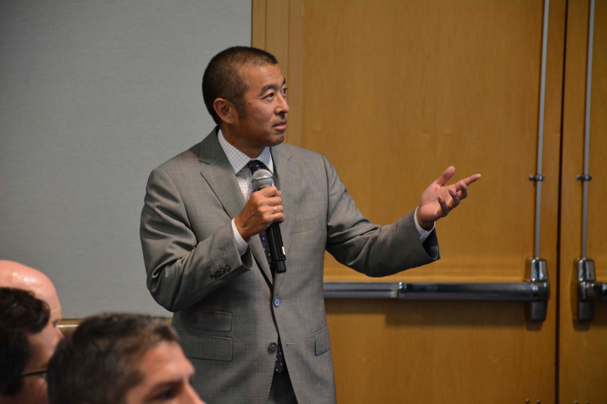 Edwin Oshiba, deputy director of civil engineers and deputy chief of staff for logistics, engineering, and force protection, briefs attendees of Air Force Day at Energy Exchange on Aug. 17, 2017.