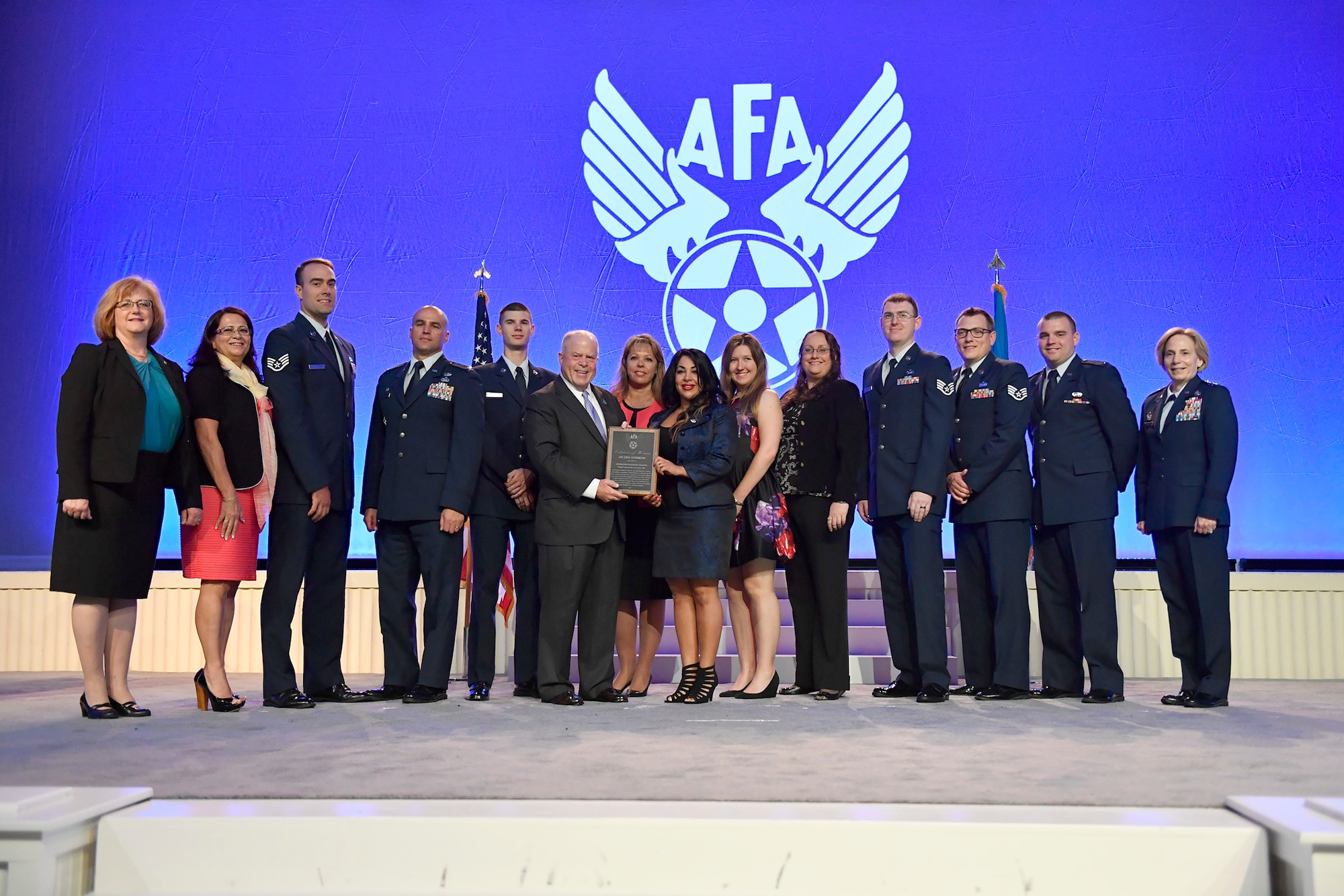 Air Force Association's Chairman of the Board F. Whitten Peters, Secretary of the Air Force Heather Wilson, Air Force Chief of Staff Gen. David Goldfein and Chief Master Sgt. of the Air Force Kaleth Wright present awards during the Air, Space, Cyber Conference