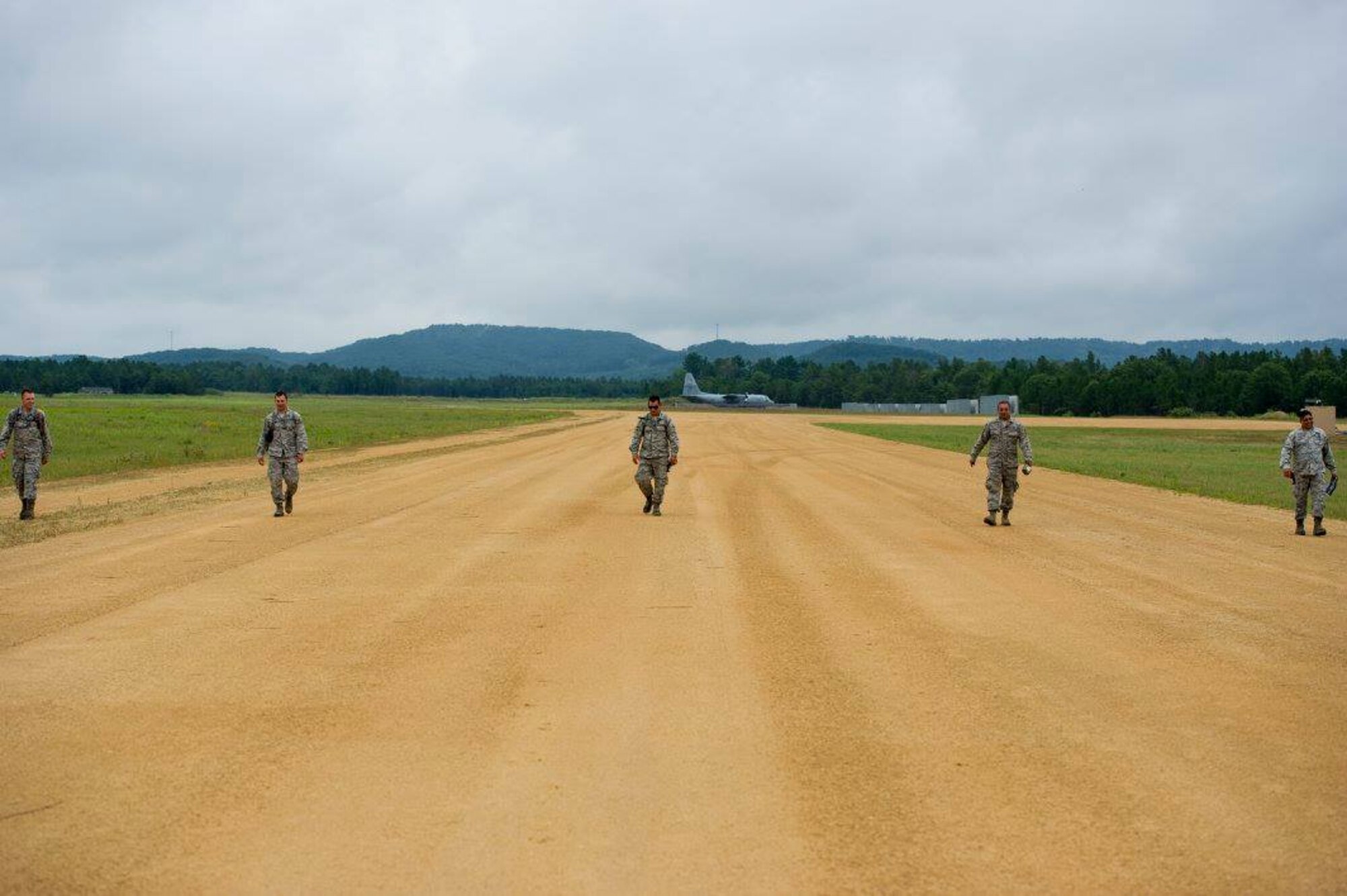 Airmen from the 302nd Civil Engineer Squadron conduct a visual inspection of the taxi way at Young Air Assault Strip, Fort McCoy, Wis., Aug. 15, 2017.