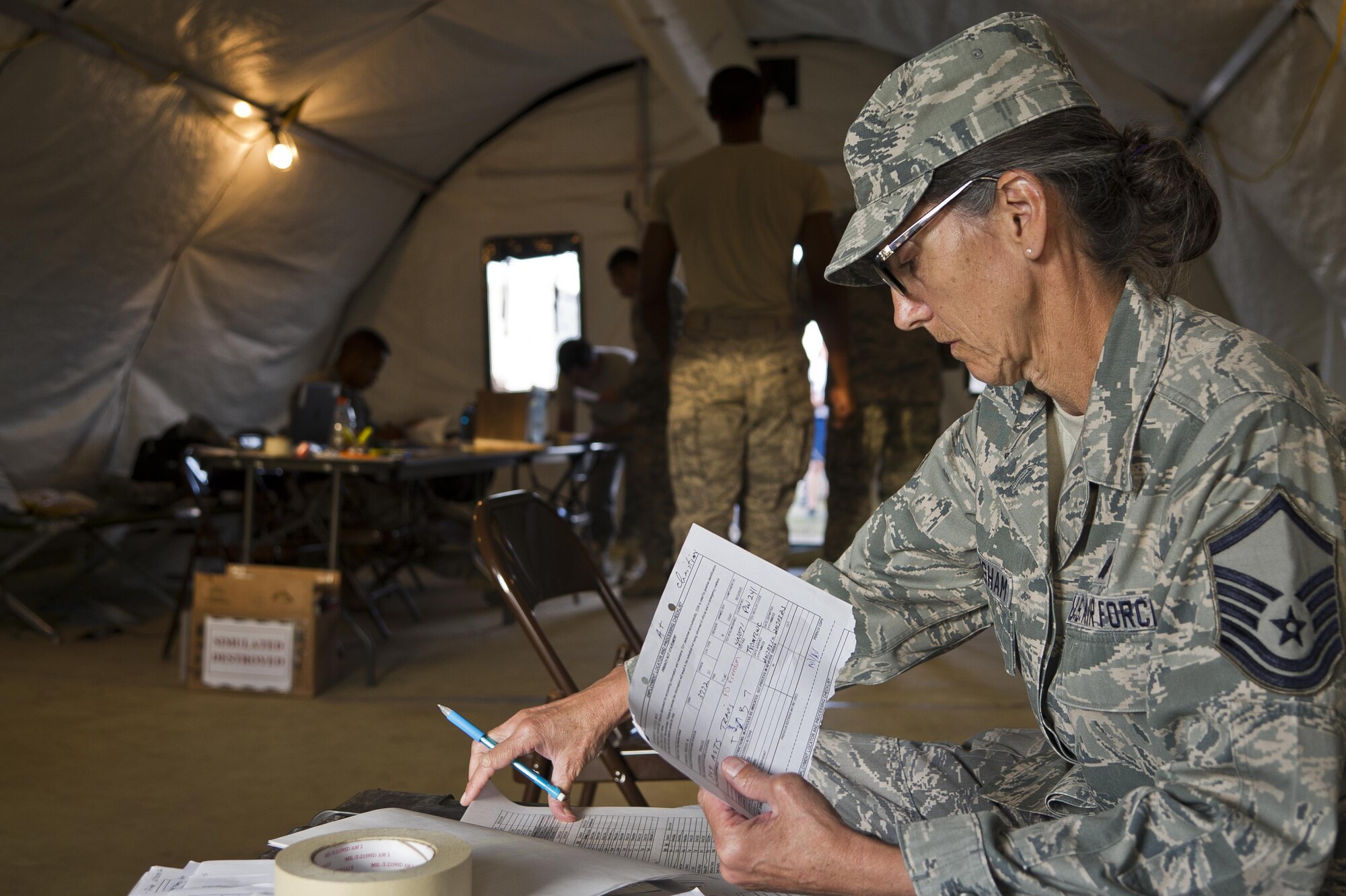 U.S. Air Force for Master Sgt. Mary Buckingham, 302nd Support Squadron, Peterson AFB, Colo., out-processes airmen through Personnel Support at Young Air Assault Strip, Fort McCoy, Wis., Aug. 22, 2017 during exercise Patriot Warrior.