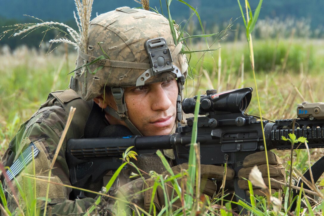 A soldier prepares to fire his weapon during a live-fire.