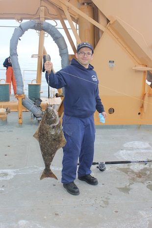 EM1 Omar Zaldivar poses with his “catch of the day”.