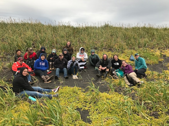 HEALY crewmembers take a break from combing the beach to enjoy the beautiful Alaskan day.