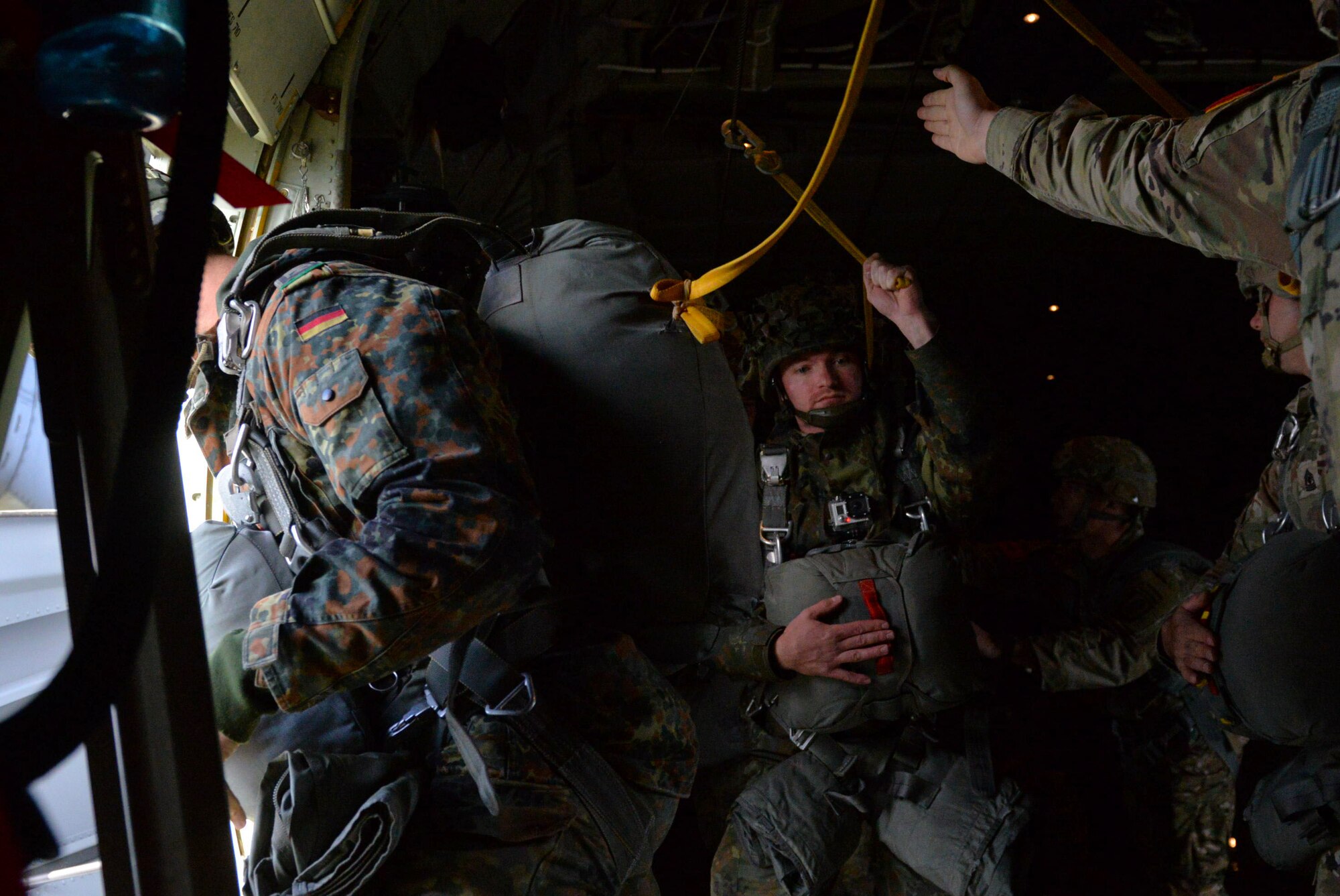 German paratroopers jump from a C-130J assigned to Little Rock Air Force Base, Ark., Sept. 14, 2017, near Ede, Netherlands. Aircrew from the 62nd Airlift Squadron participated in Falcon Leap, an international airborne exercise.  (U.S. Air Force photo by Airman 1st Class Codie Collins)