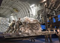 A U.S. Air Force C17 Globemaster from Travis AFB, CA unloads medical equipment and personnel from the 60th Medical Group on the island of St. Croix Sept. 8, 2017. The 60th MDG will provide aeromedical evacuation and emergency medical care to victims of hurricane Irma in the U.S. Virgin Islands. (DoD Photo by: USAF Capt. Lauren Hill / Released)