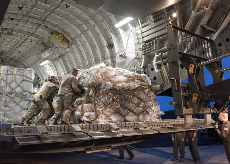 A U.S. Air Force C17 Globemaster from Travis AFB, CA unloads medical equipment and personnel from the 60th Medical Group on the island of St. Croix Sept. 8, 2017. The 60th MDG will provide aeromedical evacuation and emergency medical care to victims of hurricane Irma in the U.S. Virgin Islands. (DoD Photo by: USAF Capt. Lauren Hill / Released)