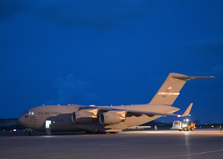 A U.S. Air Force C17 Globemaster from Travis AFB, CA unloads medical equipment and personnel from the 60th Medical Group on the island of St. Croix Sept. 8, 2017. The 60th MDG will provide aeromedical evacuation and emergency medical care to victims of hurricane Irma in the U.S. Virgin Islands. (DoD Photo by: USAF Capt. Lauren Hill / Released)