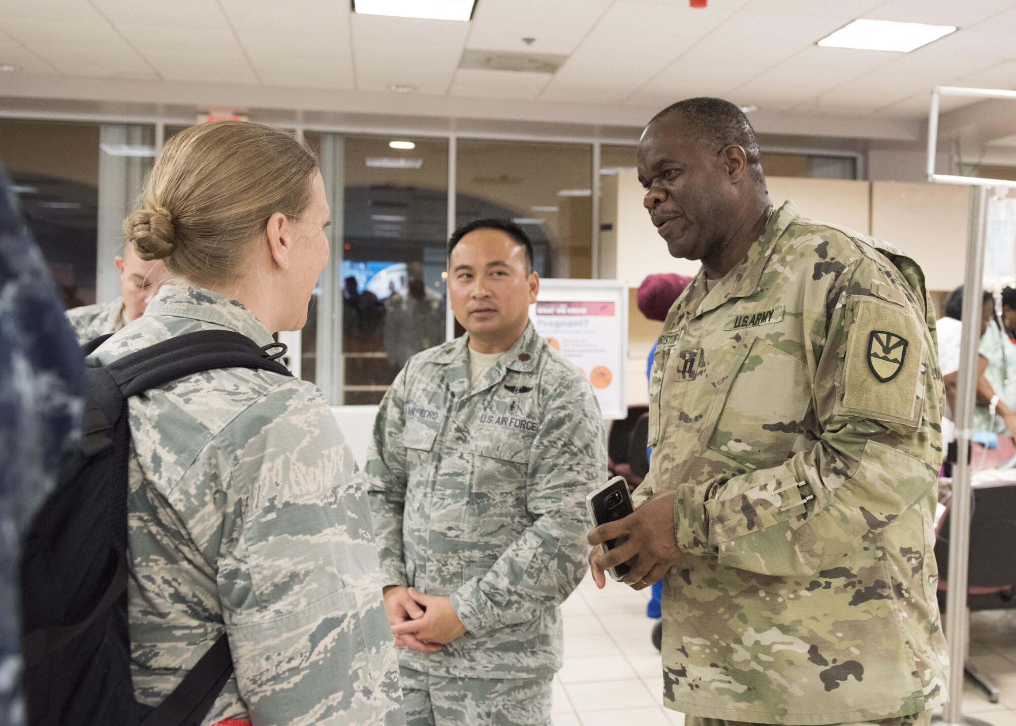 U.S. Virgin Islands National Guard Chaplain meets with the emergency medical team deployed from Traive AFB, CA to the island of St. Croix, Sept. 8, 2017. The 60th MDG will provide aeromedical evacuation and emergency medical care to victims of hurricane Irma in the U.S. Virgin Islands. (DoD Photo by: USAF Capt. Lauren Hill / Release
