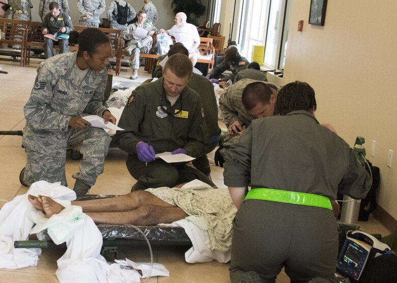 Medical personnel deployed from the 60th Medical Group at Travis AFB, California evaluate and stabilize a patient evacuated to St. Croix from St. Thomas in the U.S. Virgin Islands, Sept. 8, 2017. The Department of Defense in support of the Federal Emergency Management Agency and local officials is assisting in the care and transportation of critical care patients from the islands most impacted by Hurricane Irma earlier this week. (DoD Photo By: USAF Capt Lauren Hill / Released)