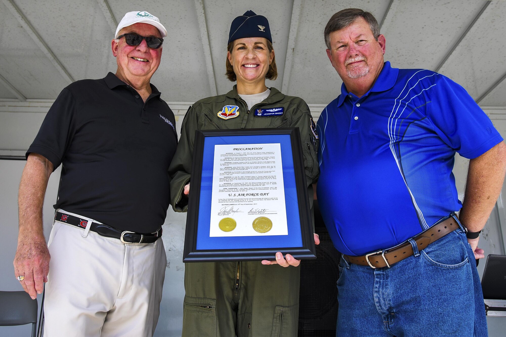 John Gayle, Mayor of Valdosta, left, U.S. Air Force Col. Jennifer Short, 23d Wing commander, middle, and Bill Slaughter, Chairman of the Lowndes County Board of Commissioners, right, display a proclamation during a U.S. Air Force 70th birthday celebration, Sept. 16, 2017, in Valdosta, Ga. During the celebration, Gayle and Slaughter both proclaimed that Sept. 16 will be named, “U.S. Air Force Day” within Lowndes County and Valdosta. (U.S. Air Force photo by Airman Eugene Oliver)