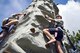 A local child ascends a rock climbing wall during a U.S. Air Force 70th birthday celebration, Sept. 16, 2017, in Valdosta, Ga. The local community and military members joined together to celebrate their 70-year partnership. (U.S. Air Force photo by Airman Eugene Oliver)