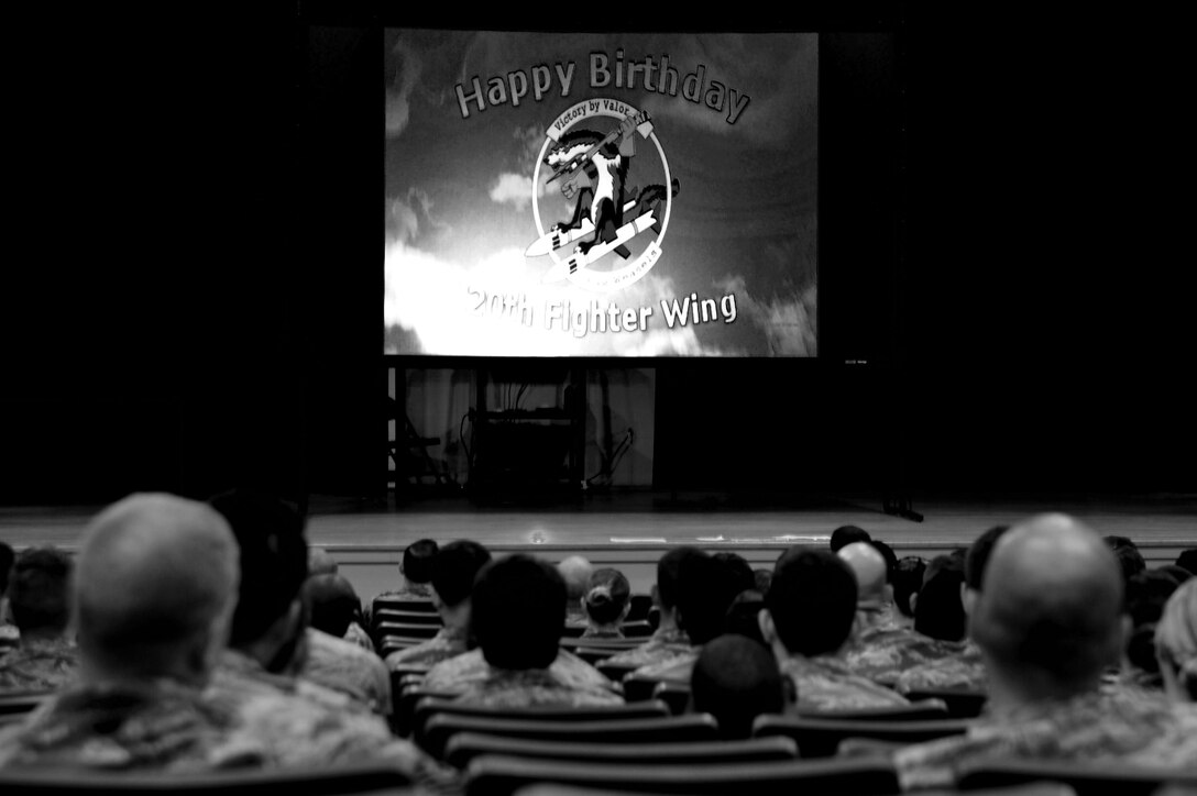 U.S. Airmen assigned to the 20th Fighter Wing (FW) watch a video highlighting the wing’s history during a commander’s call at Shaw Air Force Base, S.C., Sept. 21, 2017. The commander’s call focused on the accomplishments of 20th FW Airmen during the last year, the wing’s enduring priorities and how training will help Airmen adapt for the next fight. (U.S. Air Force photo by Airman 1st Class Kathryn R.C. Reaves)
