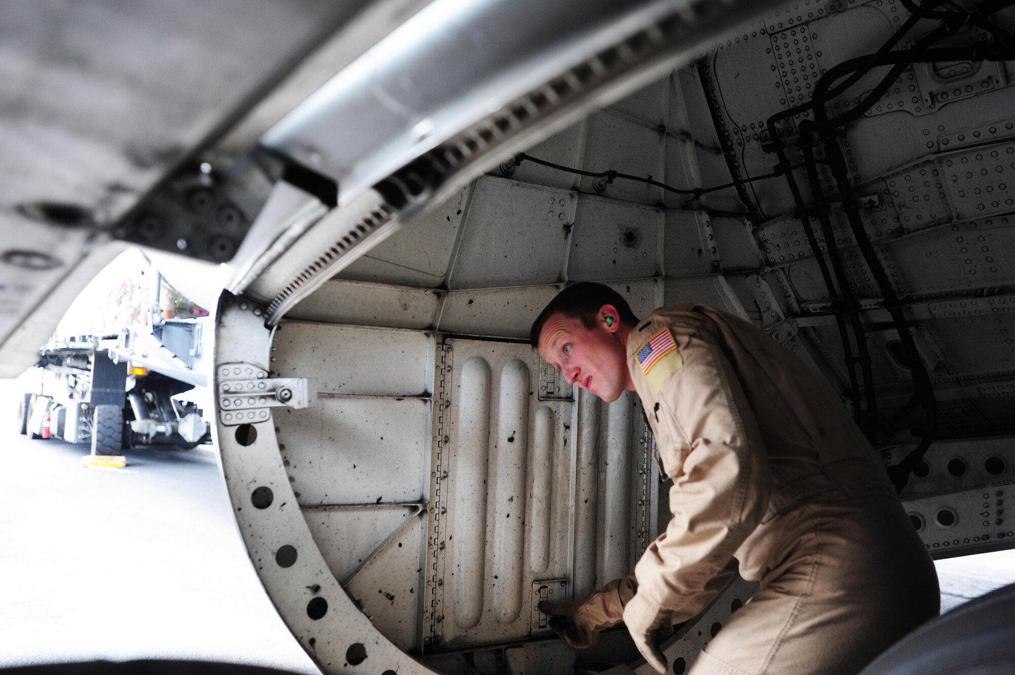 1st Lt. Thomas Holland, a C-17 Globemaster III pilot with the 535th Airlift Squadron, performs a post-flight inspection
