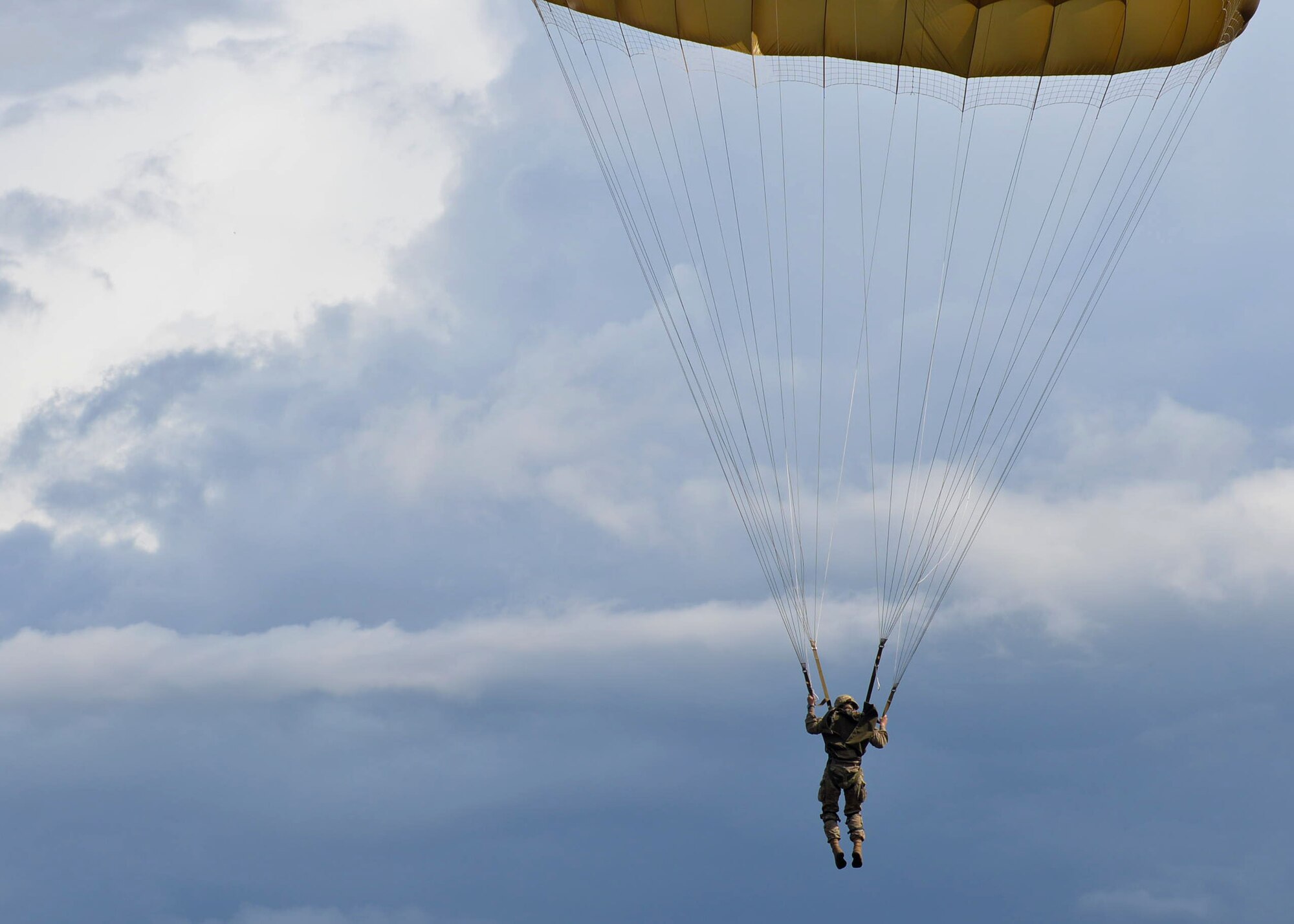 A C-130J from Little Rock Air Force Base, Ark., is flown over the Houtdorperveld Drop Zone as paratroopers conduct a static line jump Sept. 15, 2017, during exercise Falcon Leap. Aircrew members from the 62nd Airlift Squadron worked alongside eight different nations to honor and remember the sacrifices made in 1944 during Operation Market Garden. (U.S. Air Force photo by Airman 1st Class Codie Collins)