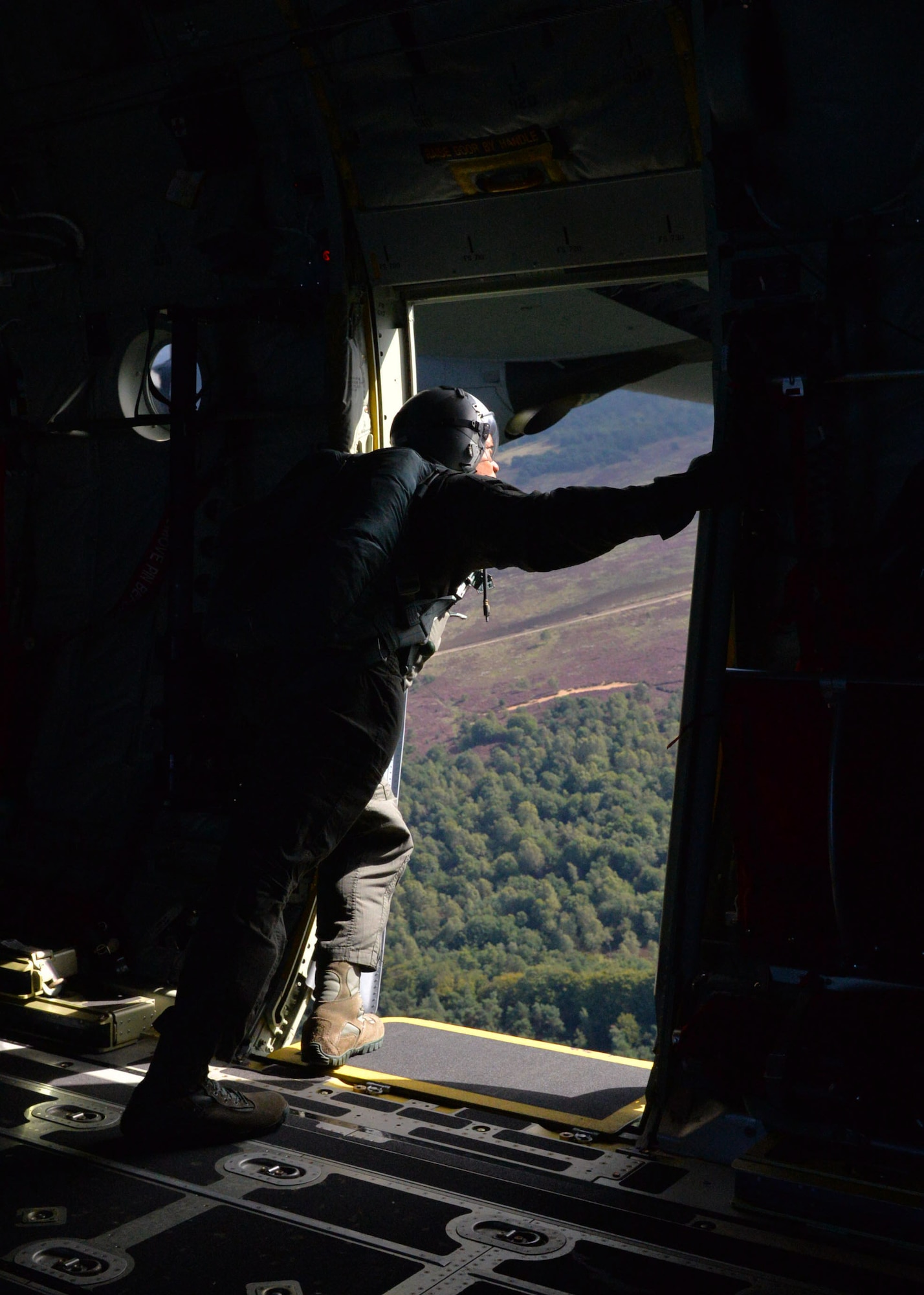 Chief Master Sgt. Lewis Holston, 314th Operations Group superintendent, surveys the drop zone prior to paratroopers exiting Sept. 14, 2017, near Ede, Netherlands. Days prior to executing personnel drops during the Operation Market Garden event, aircrews conducted personnel drops during exercise Falcon Leap. (U.S. Air Force photo by Airman 1st Class Codie Collins)