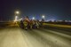 U.S. Air Force fire department and security forces members participate in an evening 9/11 memorial walk at Al Udeid Air Base, Qatar, Sept. 11, 2017.