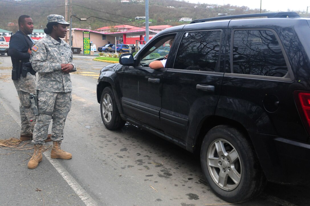 A National Guardsman speaks to a motorist.