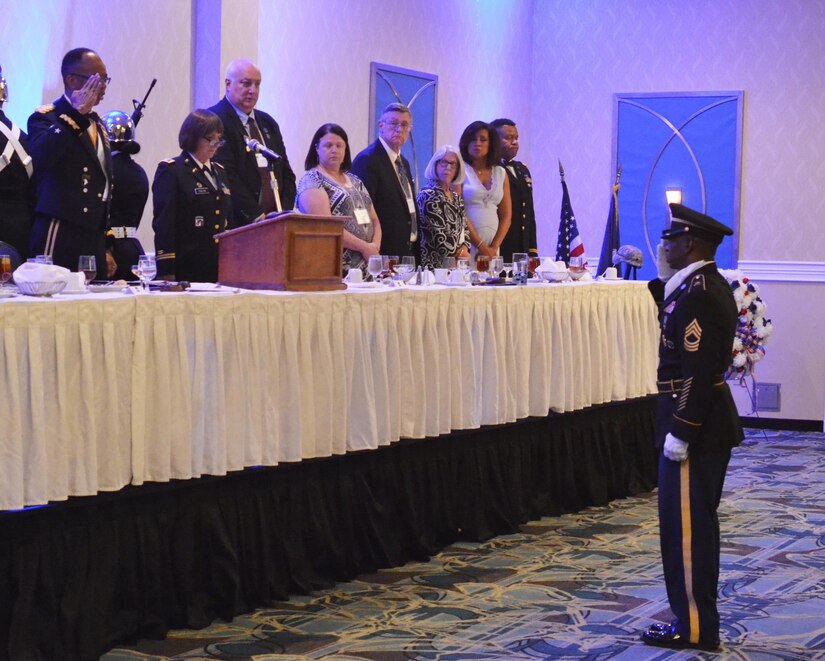 Soldiers, Veterans, retirees and civilians from the 80th TC and the 80th Division Veterans Association gathered to celebrate the centennial anniversary of the military unit. Master Sgt. Lewis Parker, the senior (Color) sergeant, salutes Maj. Gen. A.C. Roper, former commander of the 80th Training Command, to signify the start of the celebration. (U.S. Army photo by Sgt. 1st Class Emily D. Anderson, 80th Training Command)