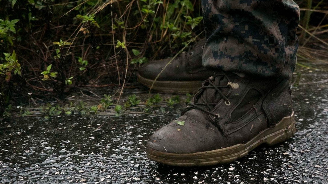 A Marine with Battalion Landing Team, 3rd Battalion, 5th Marines, takes a break before starting a patrol in the rain during Military Operations in Urbanized Terrain (MOUT) training at Andersen South Air Force Base, Guam, August 30, 2017. Marines with BLT 3/5 train regularly in different environments to maintain their readiness as the Ground Combat Element of the 31st Marine Expeditionary Unit.The 31st MEU partners with the Navy's Amphibious Squadron 11 to form the Bonhomme Richard Expeditionary Strike Group, providing a cohesive blue-green team capable of accomplishing a variety of missions across the Indo-Asia-Pacific region.
