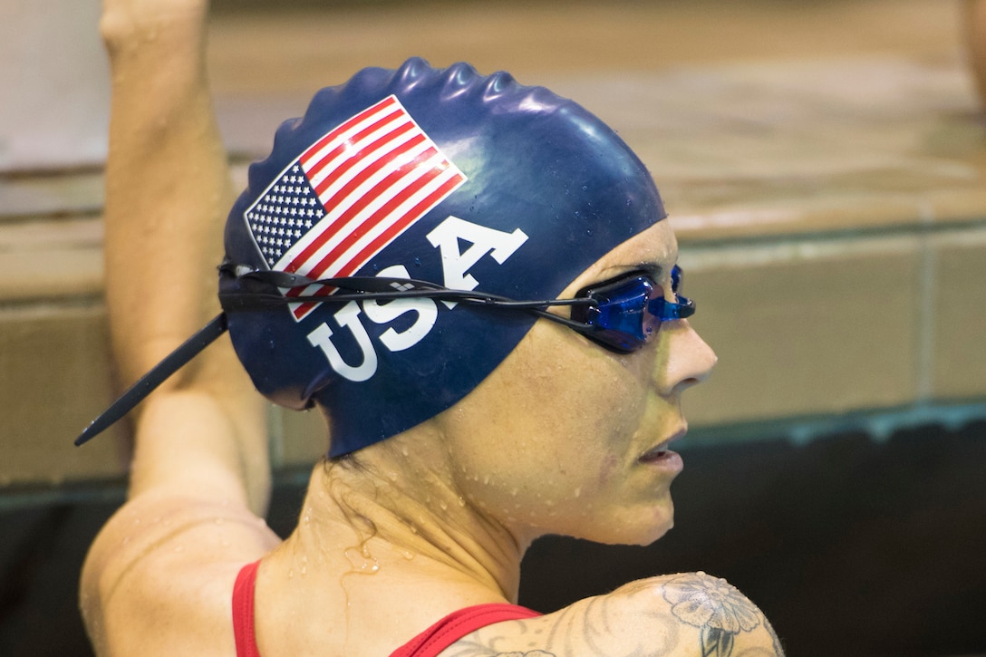 An airman checks out her score from the pool.