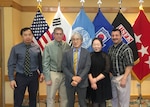 DLA Energy Pacific at Korea employee Kyu Sok Kwak poses with family after awards ceremony