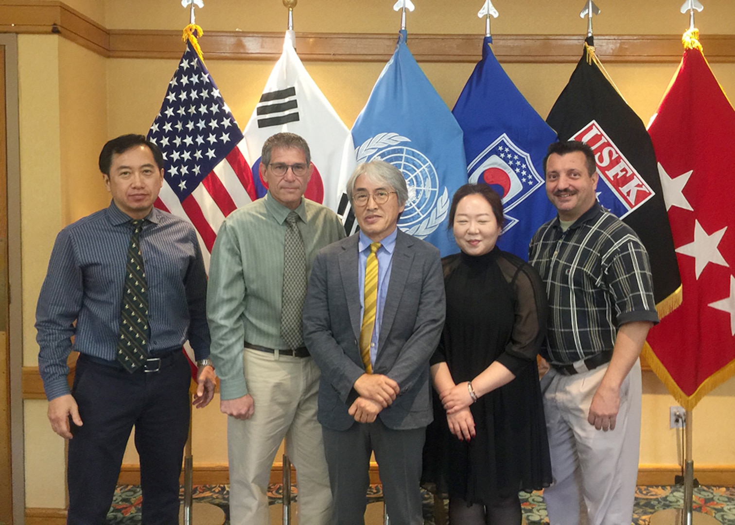 DLA Energy Pacific at Korea employee Kyu Sok Kwak poses with family after awards ceremony