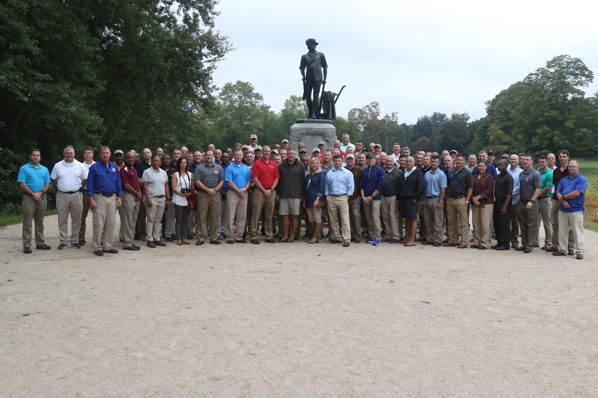 Soldiers and Airmen of the Mississippi National Guard gather around the Concord Minuteman statue for a group photo, September 16, 2017, in Concord, Massachusetts.