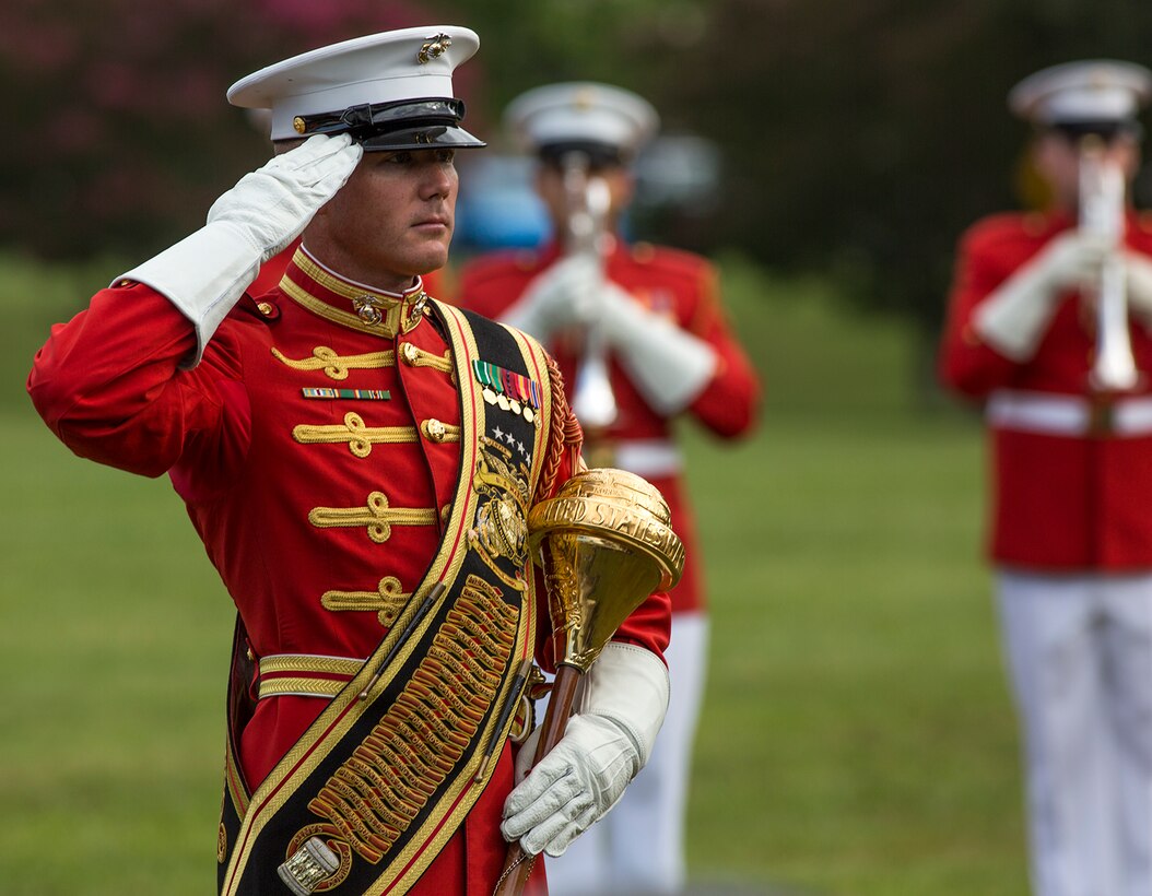 Master Sgt. Keith Martinez, assistant drum major, “The Commandant’s Own” U.S. Marine Drum & Bugle Corps, salutes the Commandant of the Marine Corps, Gen. Robert B. Neller, during the Enlisted Awards Parade at the Modern Day Marine Military Exposition (MDMME) at Lejeune Field, Marine Corps Base Quantico, Quantico, Va., Sept. 20, 2017. The MDMME is an annual exposition open to the public to display the progression of equipment and technology that is currently employed and may be utilized with future Marine Corps operating forces. (Official U.S. Marine Corps photo by Cpl. Robert Knapp/Released)