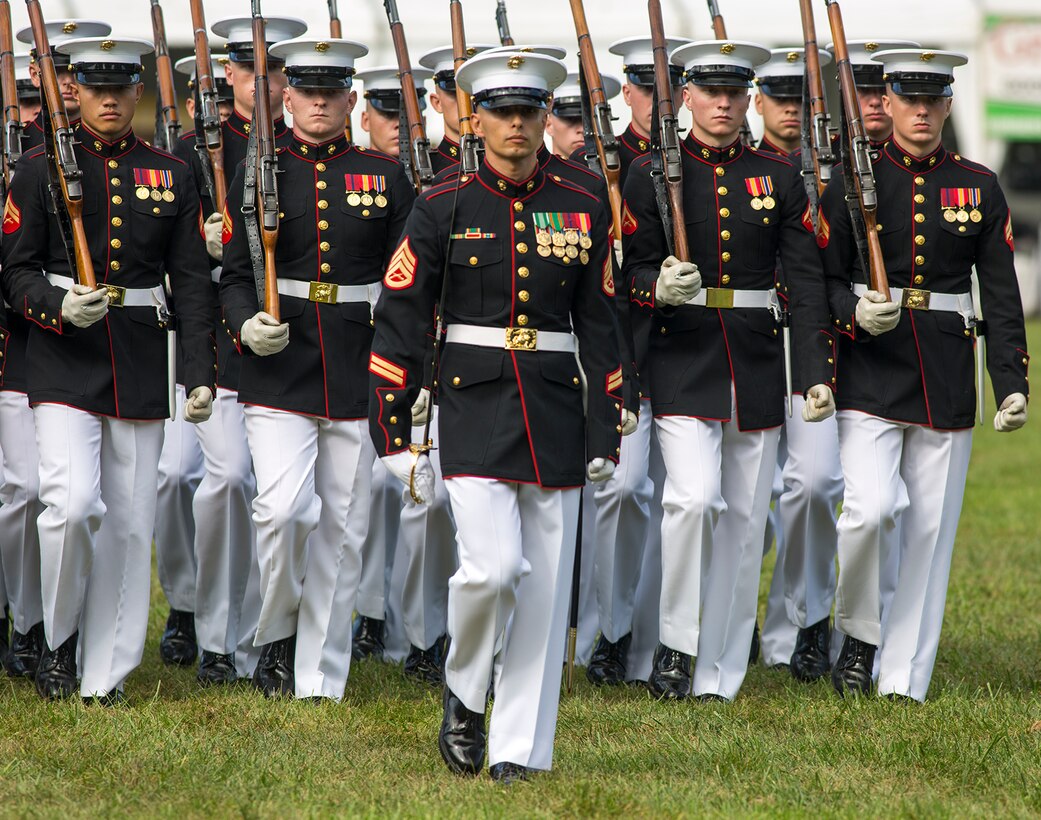 Staff Sgt. Said Lemarhi, platoon sergeant, U.S. Marine Corps Silent Drill Platoon, marches his platoon across the parade deck during the Enlisted Awards Parade at the Modern Day Marine Military Exposition (MDMME) at Lejeune Field, Marine Corps Base Quantico, Quantico, Va., Sept. 20, 2017. The MDMME is an annual exposition open to the public to display the progression of equipment and technology that is currently employed and may be utilized with future Marine Corps operating forces. (Official U.S. Marine Corps photo by Cpl. Robert Knapp/Released)
