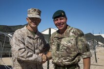 Maj. Gen. John K. Love, left, 2nd Marine Division Commanding General, shakes hands with Col. Matt Jackson, 3 Commando Brigade Deputy Brigade Commander, during Large Scale Exercise-17 in Twentynine Palms, Calif., Aug. 15, 2017. LSE-17 is a multinational exercise, led by 2nd Marine Division, with elements from the United Kingdom, France, Canada and II Marine Expeditionary Force, focused on integrating all capabilities of the Marine Air-Ground Task Force and coalition forces. (U.S. Marine Corps photo by Lance Cpl. Holly Pernell)
