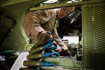 U.S. Marine Corps Cpl. John Dundon, gunner, Apache Company, 3rd Light Armored Reconnaissance Battalion, Marine Air-Ground Task Force-8 (MAGTF), loads ammunition into an Light Armored Vehicle-25A2 prior to supporting the final exercise during Integrated Training Exercise 5-17 (ITX), on Marine Corps Air Ground Combat Center Twentynine Palms, Calif., Aug. 3, 2017. The purpose of ITX is to create a challenging, realistic training environment that produces combat-ready forces capable of operating as an integrated MAGTF. (U.S. Marine Corps photo by Cpl. Christopher A. Mendoza)